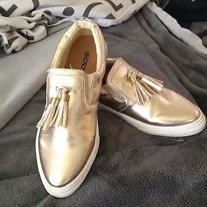 Gold slip.on sneakers